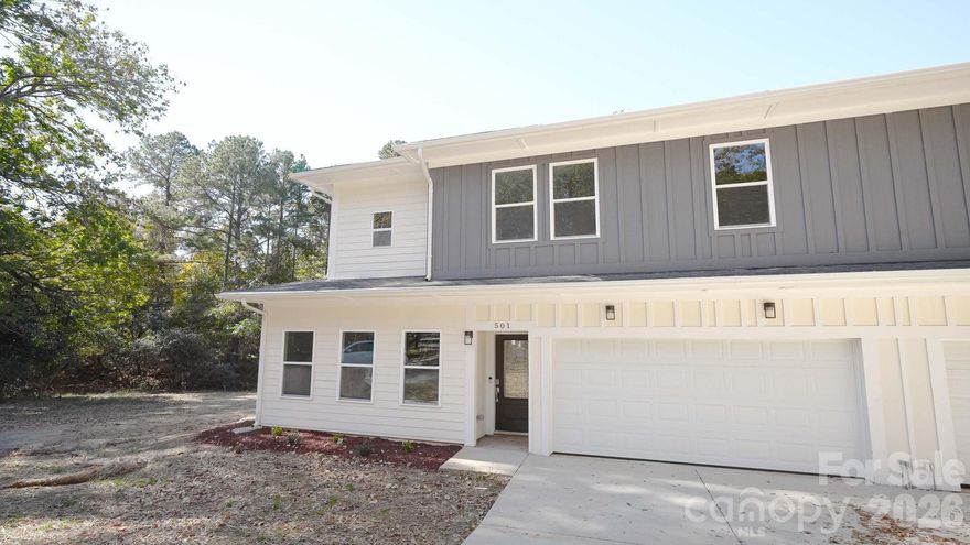 Brand-new duplex townhome near Hwy 77 and 485! Each end-unit offers 1,806 SQFT with an open layout. The chef-inspired kitchen includes 42" shaker cabinets, quartz countertops, stainless steel appliances, a large island, and ample storage—beautifully balancing style and function.premium LVP flooring. Features include Hardie siding, a 2-car garage per unit, and a concrete driveway. No HOA. Ideal for owner-occupants or investors. Minutes to South End, Uptown, CLT Airport, major highways, shopping, and dining. Move-in read. Upstairs, you'll find well-appointed bedrooms, generous closet space, and spa-style tiled showers in the bathrooms. The thoughtful floorplan provides privacy between rooms.
