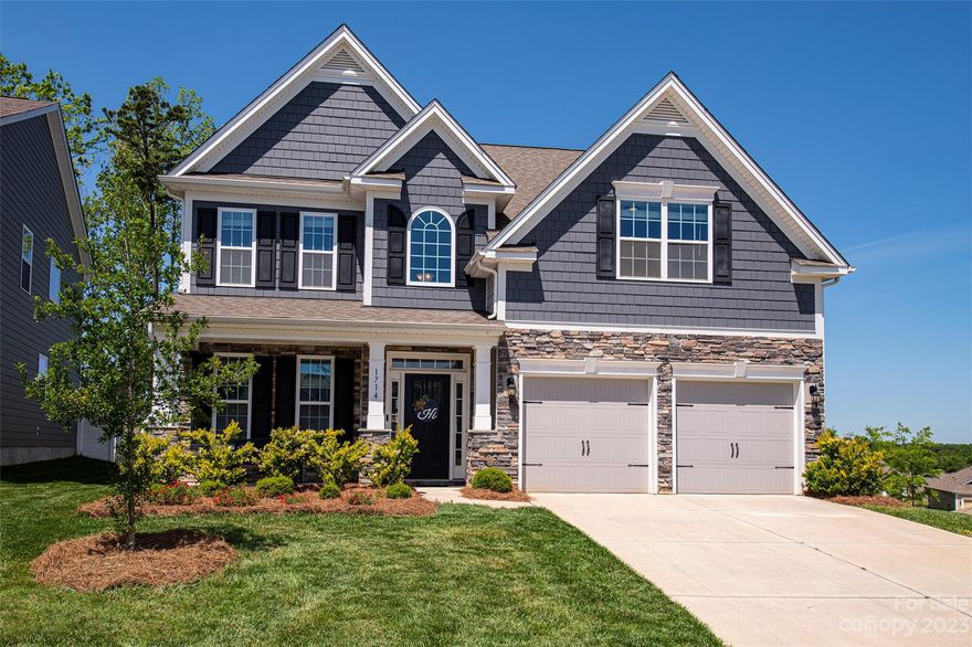 THIS ONE WON'T LAST LONG!  This beautiful home offers an open floor plan that looks barely lived in, on probably the most desirable lot in the neighborhood. It offers a gourmet kitchen with granite countertops, stainless appliances, and double ovens.  Gleaming hardwood flooring throughout the downstairs.  New black matte hardware on the doors.  If it's endless hot water you'd like, there's a tankless hot water heater that provides that as well. There's even granite countertops in the bathrooms.  There's also bonus room that can be used as a 5th bedroom.