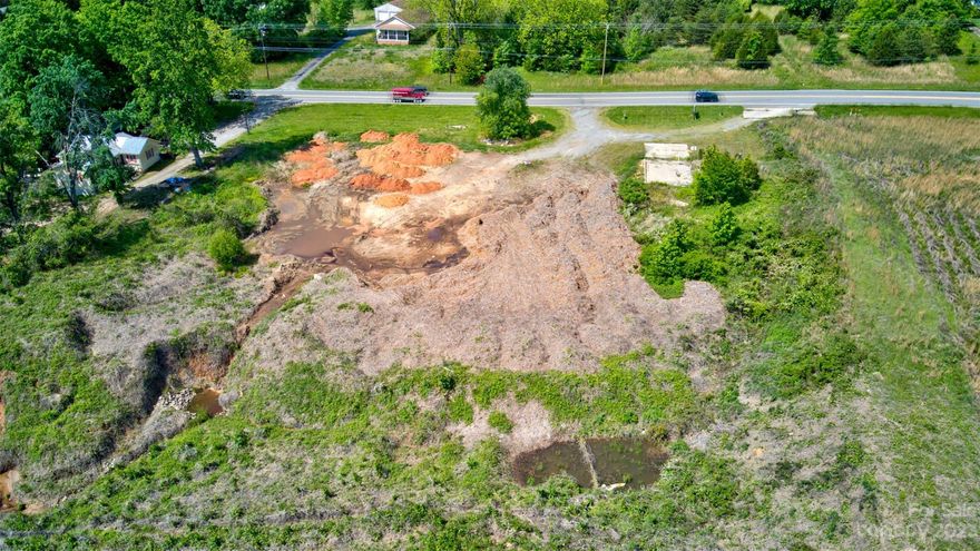Over an acre of land on Charlotte Hwy (NC-115/US 21) just off the rapidly growing Exit 42 in Troutman is ready for development! Zoned Highway Business, with access to water and sewer at the street, this lot offers approx 224' of road frontage. This parcel is in a prime location just seconds from Lowes, Sheetz, Pilot, Fast Food Chains, and multiple residential and commercial new construction projects. Per the NCDOT, in 2020, the annual average Daily traffic was approximately 13,500 vehicles and is only anticipated to grow. The seller is open to a possible lease.  Also crossed listed as vacant land - see MLS 3844221.