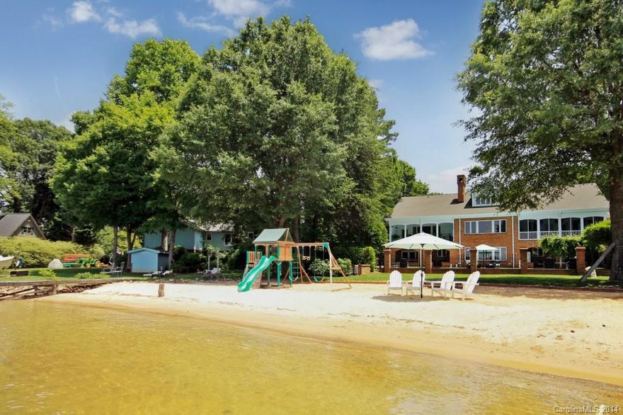 Langtree/Big Water/Sunset Views/Huge Beach. Fully renovated 7,000 sq. ft, entire house hardwood flrs & mldg, chefs kitchen, pool, private pier & lift. His/Her Master Baths & Closets, Home Office, Home Theater w/9 electric seats, 3 fpl, exercise room w/sauna, two separate living quarters w/2 kitchens, 2 laundry, 2 great rooms. 3rd bay under house, 1,800 add'l sq ft unfinished & plumbed upper level.