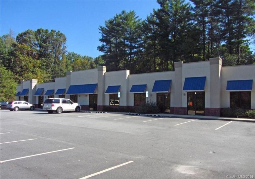 Income producing strip center across from Discount Shoes on Brevard Rd corridor. High growth area with popular new Asheville Outlets Mall near by. Also neighbors the French Broad River, Bent Creek, NC Arboretum. Owner pays taxes/insurance and tenants pay utilities. Ample parking. Price includes adjacent 1.34 acre parcel #9626-72-8527 for a total of 2.57 acres.  Price is $850,000 for just the building: parcel #9626-72-7909.
