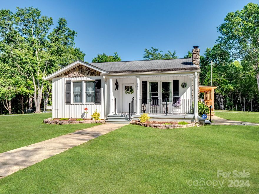 Nature Lover's Paradise! This cozy, 'Fully Remodeled' 3 BDRM, 2 BATH Ranch Home is nestled on a sprawling 5.43 acre lot. Upgrades & Features include: New vinyl plank flooring & carpet (2022). Sliding Barn Doors in Living Room (2022). Kitchen fully remodeled w/ new cabinets, granite tops, island & tile backsplash (2022). Both Bathrooms completely remodeled w/ granite sinks, tile, tub, showers (2022). All new electrical wiring including fixtures, lighting & ceiling fans (2022). Plumbing & Well replaced (2022). New windows (2022-'23). New doors (2022). New electric Water Heater (2022). New (rarely used) Trane HVAC Heat Pump & Central AC (2018). New ceiling in semi-finished basement (2024). New vinyl siding (2023). Two new stone chimneys & stone gable (2024). Wrap-around deck & covered front porch added (2023-'24). Roof (2014). 3-Bay, 45' x 30' x 12' Garage w/ 100 amp electricity. (2023). 12' x 12' storage shed w/ water + electric. 24' x 12' Utility Shed. Circular Driveway and MORE!