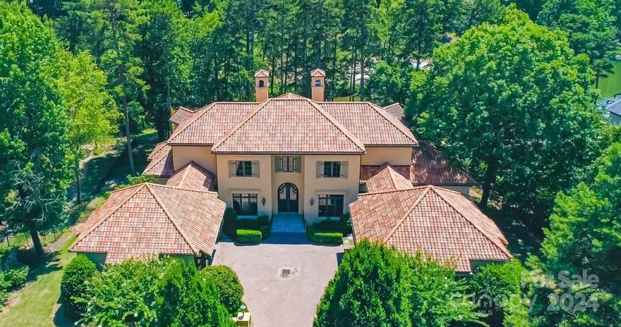 Located within the prestigious Point Community & Trump National Golf Course, this gracious Tuscan style custom home was truly a showplace when it was new! Built by Kenneth Bealer Homes on the WATERFRONT with amazing 10th hole GOLF COURSE VIEWS with a walk-to BOAT SLIP down the boardwalk behind the house. Today it is in need of extensive repairs: The tile roof is leaking in multiple areas. ALL plumbing & plumbing fixtures, as well as ALL HVACs & hot water heaters will need replacement. Many areas within the home had evidence of mold & have been either treated or drywall removed. The left garage ceiling is still discolored & not treated. There are Golf, Tennis & Swim memberships available for purchase but the social Membership is required. THIS HOME IS BEING SOLD AS IS. The bank will review offers after 10 days on the market. ALL OFFERS FOR THIS PROPERTY MUST BE SUBMITTED VIA THE AGENT PORTAL. OFFERS WILL NOT BE CONSIDERED IF SUBMITTED BY ANY OTHER METHOD. See Agent remarks for details.