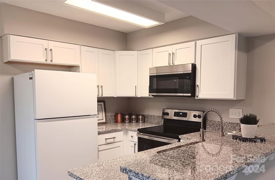 Perfect for First Time Home Buyers, Downsizing, etc. Extensive Rehab Includes NEW: Kitchen With White Shaker Kitchen Cabinets with Soft Close Feature, SS Appliances, 9" Undermount Sink, Granite Countertops with overhang bar stool sitting area, Cabinet Pulls, Luxury Vinyl Plank Flooring, Carpet & Pad, Vanity, Toilet, Designer Faucets, Mirror, Lighting, Ceiling Fan, Door Knobs, Hinges, Hardware, Supply Lines, etc. Also: New HVAC and Hot Water Heater..!! Window glass replaced where needed. Fresh Paint Inside. Too Much to List. Reasonable HOA Dues of $190/mo. Award Winning Schools. Move In Ready..!! Main Level Entrance. Pet Friendly. Quiet Wooded Setting. Potential Seller Financing with 150k Down. With most everything New this should be somewhat maintenance free.