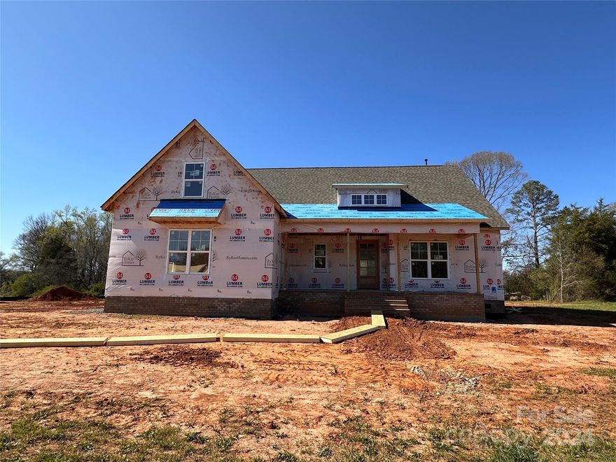 Discover living at its best in this 4 BR 3 BA + Bonus new build on a 1-acre lot. The Blakely model offers a perfect layout with main-floor Owner's BR and inviting bath with 5' soaking tub and frameless glass shower. Two add'l beds & a full bath complete the convenience of the first floor. The Family Room with remarkable 10' coffered ceilings and a 12' multi-slide door opens to the rear screened porch, creating a harmonious indoor-outdoor connection. The kitchen features timeless white cabinets extending to the ceiling, complemented by an upgraded deco island & Alabaster White quartz counters. Professional-grade Z-Line appliances elevate the culinary experience. A spacious informal dining area overlooks the backyard. Upstairs you'll find a bedroom with an attached bath and a versatile bonus room with closet. Don't miss this opportunity to live within this sought-after new community of Edmunds Farm in Clover SC.  Completion by May/June 2024. Additional homes available, Call for details.