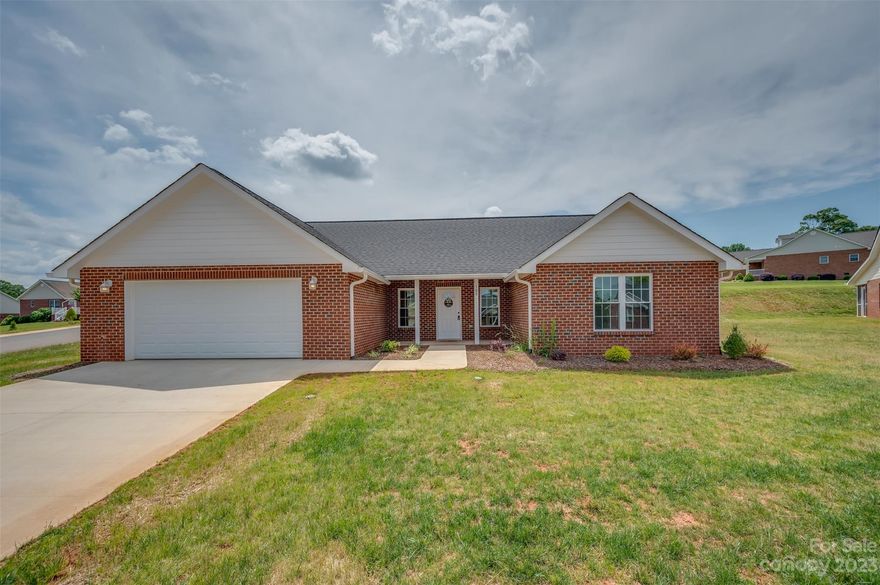 Beautiful new construction home located in Sparks Crossing, a well-established 55+ community. This 2 bedroom, 2 full bath floorplan is open concept and has wide doorways, vaulted ceilings, a beautiful gas log fireplace, granite countertops, and soft close cabinets/drawers. The 2-car garage and walk in closets are oversized and offer ample space for extra storage, if needed. Last but not least, a relaxing screened porch on the back of the home is the perfect spot to enjoy the outdoors after a long day. Sparks Crossing is a 55+ community with an HOA that maintains the landscaping. It also provides two stocked ponds, underground utilities, public water and sewer, and has very easy access to the Thermal Belt Rail Trail. Don't miss the opportunity to call Sparks Crossing your home!