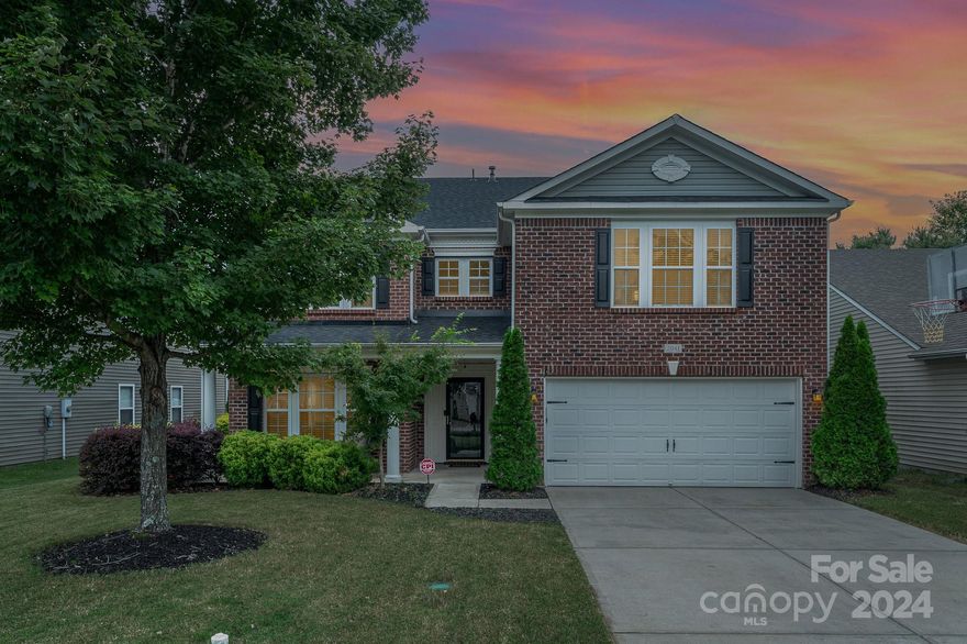 Gorgeous brick front home is a neighborhood showstopper. Lovely covered front porch and landscaping greets you as you arrive. Entertainers dream with an open concept kitchen, dining area, family room and living room. Let your parties extend outdoors to the massive covered back patio, just in time for football season! Beautiful gas fireplace in Living Room. Kitchen features recently updated countertops. Main level office provides a perfect work from home experience. Neutral LVP flooring throughout the entire main floor provides a cohesive flow. Mudroom off the garage has custom built-ins for shoes and coats. Expansive owner’s suite on the second level boasts a large ensuite with a newly updated bathroom and custom walk-in closet. Loft area is the perfect flex space. All bedrooms feature walk-in closets. HOA amenities within walking distance. Close to downtown Fort Mill, Pineville, Ballantyne, highway access, entertainment and shopping. Award winning Fort Mill Schools. New roof in 2024.