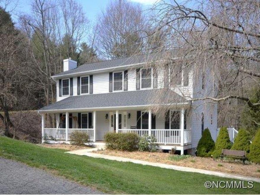 Move-in-ready updated home w/hardwood floors in the main living areas & fresh paint. Sited on a double lot w/close range views. Enjoy nature from the rear deck or relax on your covered front porch. Formal living, dining, den/family room & eat-in kitchen on main level. Master & 3 additional BRs upstairs. Lower level offers 5th BR or bonus/rec room w/wet bar & bathroom. Great location w/easy access to shopping, restaurants & more.