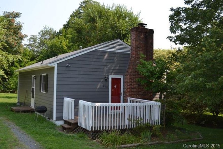 What a dollhouse!  Move in ready!  This home has a spacious great room with fireplace as well as a large kitchen.  Two bedrooms and a laundry room.  Large back yard, front deck.  Roof is only 2 years old.  Great location that is convenient to everything!  Inspection report available upon request.