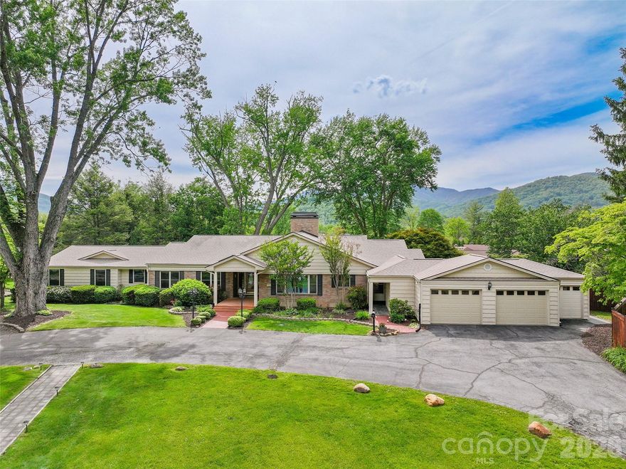 A rare find in the heart of Waynesville, this updated historic home offers space, comfort and strong investment potential. Located near the Waynesville Inn and Golf Club, the property is ideal for a large family, multigenerational living or short-term rental use.

Set on 1.55 acres, the home features a flat yard, mature landscaping, privacy fencing for pets, beautiful Balsam Mountain views and a peaceful creek. There is also space for an RV, with electric and water hookups already in place.

Inside, the main home offers a formal foyer, updated eat-in kitchen, butler’s pantry, formal dining room and a large wormy chestnut living room with a fireplace. The main level includes five spacious bedroom suites. The lower level has private guest quarters with a separate entrance, along with a large family room or recreation area with a gas fireplace.

Additional features include a golf cart garage, a large two-car garage and plenty of parking. The property also offers room to add another garage, guest quarters or rental cottages.

A major bonus is the separate Airbnb-style cottage space under one roof. Each cottage includes a full kitchen, dining area, living room and bedroom suite, creating excellent income potential or extra space for guests.

This is a unique Waynesville property with room to live, host, invest and enjoy the best of mountain living.