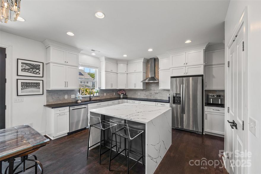 Stylish, spacious, and made for elegant living. From the fabulous curb appeal with in-ground irrigation to the amazing kitchen, every detail has been thoughtfully designed. Inside you will find your dream kitchen with a spectacular waterfall quartz island which opens to comfortable dining and living space-perfect for everyday moments and entertaining alike. Main floor bedroom and full bathroom, ideal for guests or flexible use. A dignified office with french doors makes a perfect work space. Upstairs step into your private retreat-an expansive primary bedroom with an airy layout and beautiful coffered ceiling creating a sense of calm and luxury. The impressive ensuite bathroom has an massive walk-in closet. Laundry room is conveniently located between the 4 bedrooms. The top floor versatile flex room w/ensuite bathroom offers endless possibilities-movie room, home gym, bedroom or playroom to suit your lifestyle. This home provides space, style, and location in one perfect package.