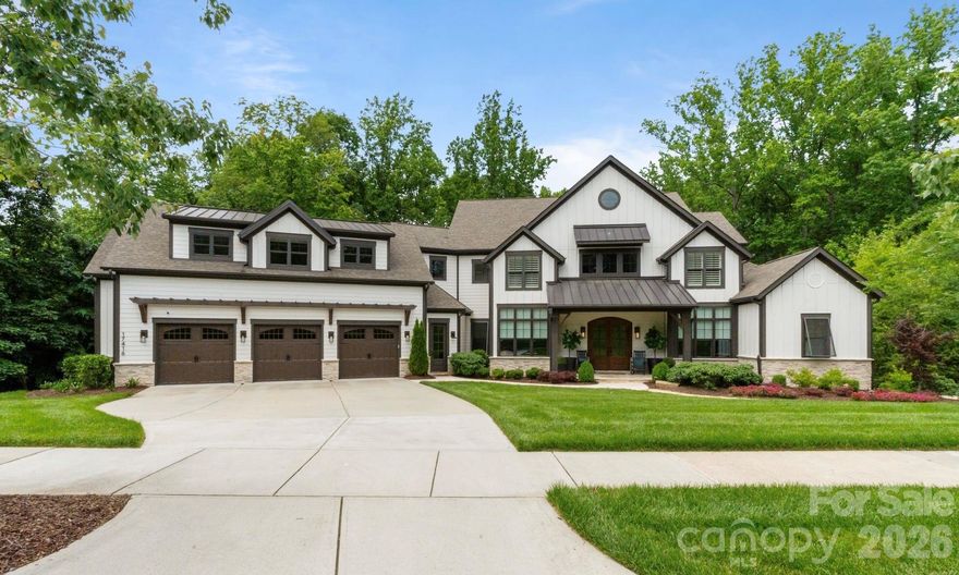 Set on 1.8 private acres in The Reserve at River Run, this exceptional 6500 sf custom home was masterfully designed by Kathryn Lilly Interiors, seamlessly blending refined sophistication with everyday livability.
Surrounded by serene park and wooded views, the two-level residence offers both privacy and presence. The main level is anchored by a true chef’s kitchen featuring a dramatic quartz waterfall island, 72” integrated refrigerator/freezer, professional-grade appliances, and an expansive walk-in pantry complete with an additional 36” refrigerator-ideal for effortless entertaining. The primary suite is a private sanctuary on the main level, offering a spa-inspired bath and a fully customized dressing room. A generous guest suite with ensuite bath provides comfort and convenience for visitors. Upstairs, a spacious game room with wet bar creates the perfect gathering space, alongside three additional bedrooms- each with its own ensuite bath. A thoughtfully designed private wing offers ultimate flexibility for an au pair, in-laws, or extended stay guests, complete with a second laundry room, kitchenette, and expansive bonus space. Seamless indoor-outdoor living is showcased through two screened porches featuring a fireplace and built-in gas grill- perfect for year-round enjoyment. The resort-style backyard is a true retreat, highlighted by a custom pool and spa surrounded by luxurious travertine hardscape.
Additional features include a standing-height encapsulated crawlspace offering exceptional storage, and a 3+ car garage outfitted with custom storage systems, epoxy flooring, and EV charging stations.
Experience the luxury of space, privacy, and thoughtful design- all while enjoying the premier lifestyle of River Run and the charm of Davidson.