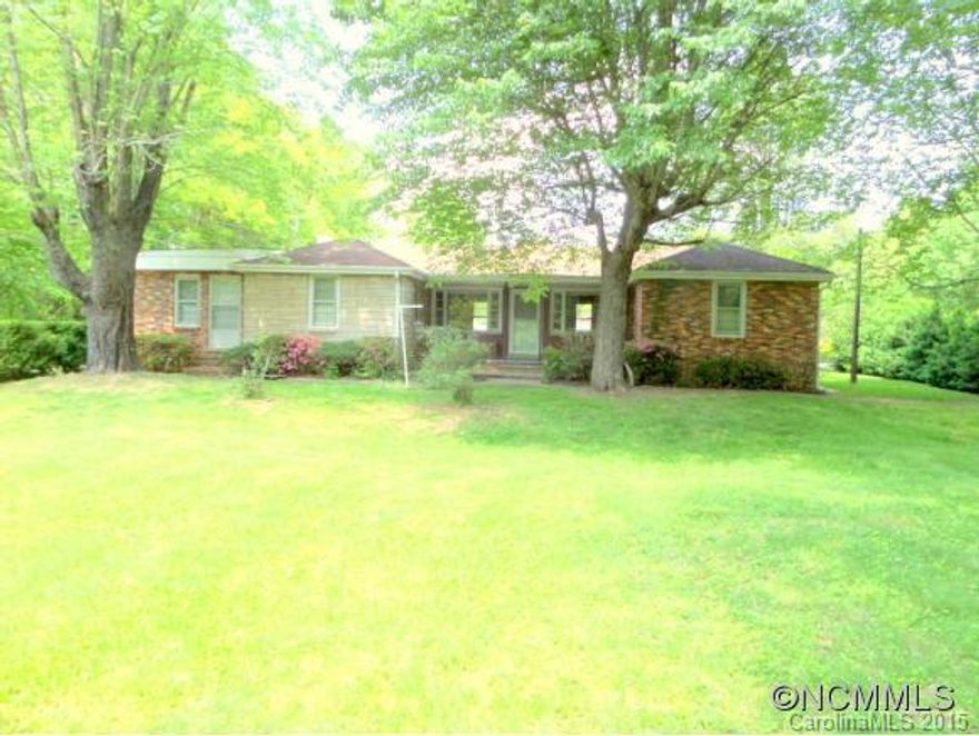 Classic brick and stone ranch in storybook setting. All one level three bedroom with bonus room, living room with gas logs, huge eat-in kitchen, and chef's pantry. Over half an acre in a level, corner lot with circular drive and loads of parking.  Detached building for garage/workshop/storage and multi-vehicle carport. Close to downtown, yet country feel. Don't miss this one. Also great investment property potential. Home sold "As Is".