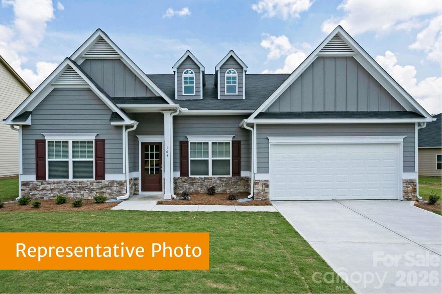 The Avery model home in Pine Bluff is now available for sale!  The Avery is that rare ranch style home with 3 spacious bedrooms, 3 full bathrooms and over 2400 square feet of comfortable living space. Upon entering you will step into a sizeable foyer that leads to an ample dining room and opens to a beautifully appointed kitchen. The upgraded kitchen includes 42-inch white cabinets with crown molding, stainless steel appliances, granite countertops, and a seated breakfast bar. As the kitchen opens to the family room, it creates an inviting atmosphere perfect for gatherings and everyday living.  The tray ceiling in the family room and primary bedroom add to the spacious feeling of this home. The primary bedroom boasts a luxurious ensuite that includes a walk-in closet, double sinks and a spacious tiled shower and bench - your own private oasis for relaxation. Outside you will enjoy a beautiful corner lot, with a patio and sizeable open area behind the home. Model "extras" include ceiling speakers in the primary and family rooms, crown molding, upgraded lighting and ceiling fans, tiled floors in the bathrooms and laundry room, a linear fireplace, refrigerator, washer, dryer and more.  This home is a must see!  Located just minutes from Villages at Red Bridge shopping center, Locust Town Center, Red Bridge Golf Club, grocery stores, Rob Wallace Park and a short drive to the 485 beltway, Novant Health Mint Hill Medical Center and Publix. Come visit our model and see this home in person. You will not be disappointed! ASK ABOUT OUR SPECIAL FINANCING AND EXCITING PROMOTIONS!