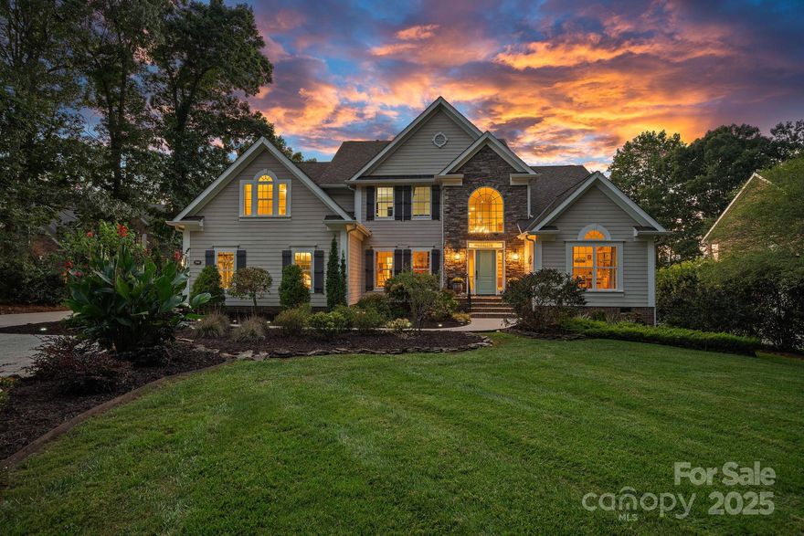 This stunning waterfront home in The Harbour at The Pointe boasts long-range spectacular sunset views and a private sandy beach. Spanning approximately 5,600+ sq. ft., it features 4 bedrooms, 4.5 bathrooms, a pretty kitchen with granite countertops, a lakeside primary suite, a sunroom off the kitchen, a dining room, a private office, a laundry room, and a two-story great room with a granite surround gas fireplace, all on the main floor. Upstairs, there are three bedrooms and a bonus room. The lake level is designed for fun, with a stylish family room, an expansive custom wood bar crafted by Vine and Branch, equipped with two mini refrigerators and a wine cooler refrigerator, a beautiful bathroom, a stone fireplace, and a billiard room. Outside, enjoy a CertainTeed roof, a vast wood deck approximately 750+ square foot, covered patio, fire pit, private dock with a newer hydrohoist boat lift and jet ski ramp, a sitting area, an outdoor shower, lake-fed irrigation, and mature landscaping on a cul-de-sac lot. Community amenities include a pool, two tennis courts, new pickleball courts being built, volleyball, basketball, a clubhouse, and a playground.