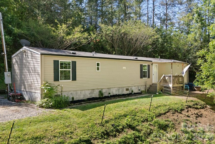 Tucked away on 1.76 private acres, this charming mobile home offers the perfect blend of peaceful country living and functional outdoor space. Surrounded by nature and set back for added privacy, the property provides plenty of room to relax, garden, or simply enjoy the quiet setting. A large fenced-in area makes it ideal for animals, pets, or hobby farming, giving you the flexibility to create your own mini homestead. Whether you're looking for a full-time residence, investment property, or mountain getaway, this property offers space, privacy, and endless potential.