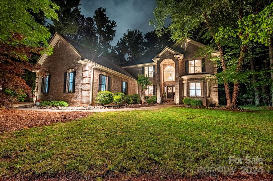 Discover Southern Living with instant equity! All-brick residence exudes charm, nestled on nearly half an acre in a quaint well-established community where beautiful mature trees and landscaping invite leisurely strolls in the neighborhood. A grand foyer welcomes all with crown molding, custom trim, and hardwood floors, lending an air of sophistication to the open floor plan. The kitchen features an island, breakfast bar, wine rack, walk-in pantry, and bay window breakfast nook, all flowing seamlessly into the living room with a cozy fireplace. A formal dining room is just steps from the kitchen. The gracious primary suite is a true retreat with whirlpool tub, separate shower, furniture vanity with dual vessel sinks and spacious walk-in closet. Upstairs, multiple baths and bedrooms offer endless possibilities for versatile living spaces. An oversized 2-car garage, inground irrigation, and landscape lighting make this home everything you have been looking for!