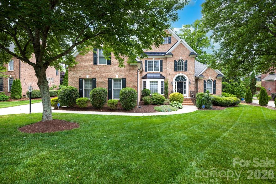 Set on a beautifully maintained .30-acre homesite just outside the Fort Mill city limits, 886 Hickory Stick Dr offers an exceptional blend of space, comfort, and timeless appeal. This all-brick residence immediately impresses with its stately presence, lush landscaping, and plush, manicured lawn that enhances curb appeal and creates a welcoming first impression. Inside, the home unfolds with a thoughtful and highly functional layout featuring five spacious bedrooms, including a desirable primary suite on the main level, offering both privacy and convenience. The main floor is designed for both everyday living and entertaining, showcasing a formal living room and a warm, inviting family room that provide flexible gathering spaces filled with natural light. The heart of the home is the updated kitchen, thoughtfully designed with modern finishes, ample cabinetry, and generous prep space, making it equally suited for casual meals or hosting larger gatherings. Hardwood floors extend through much of the main living areas, complemented by a neutral color palette that creates a bright, cohesive feel and allows for effortless personalization.

Upstairs, you’ll find additional bedrooms along with a dedicated office space, perfectly positioned for remote work, study, or creative pursuits while maintaining separation from the main living areas. This upper-level layout provides flexibility for a variety of lifestyles, whether accommodating guests or creating private retreats for family members. The home’s design balances openness with defined spaces, ensuring both comfort and functionality throughout.

Step outside to experience an outdoor living setup that truly elevates the property. The rear deck overlooks the expansive backyard and offers an ideal setting for morning coffee or evening relaxation. Below, a thoughtfully designed stone patio creates a second entertaining area, complete with a firepit with a sitting area, a partial outdoor kitchen with built-in grill with a dedicated gas line and mini fridge—perfect for hosting cookouts, game days, or weekend gatherings with ease. The combination of these outdoor features, along with the generous lot size and fenced yard provides ample room to enjoy both recreation and quiet moments in a private setting.

Located in a desirable Fort Mill area just outside city limits, this home with a 3-car side load garage offers added flexibility while still maintaining convenient access to everyday essentials. Commuters will appreciate the easy access to I-77, making travel to Uptown Charlotte efficient and straightforward. With its blend of classic all-brick construction, updated interior features, versatile floor plan, and inviting outdoor spaces, 886 Hickory Stick Dr presents a compelling opportunity for buyers seeking a well-appointed home in a prime, connected location.