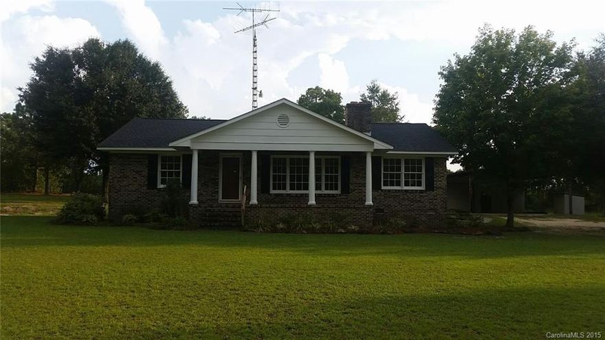 Don't miss this attractive brick ranch located on 4.8+- acres with huge shop/covered shed.  It features 3 bedrooms, 2 bathrooms, eat in kitchen with lots of natural light, living room with fireplace, laundry room, covered front porch, rear covered patio and lots of room to roam.  New carpet and vinyl floor covering, fresh paint inside and outside, new stove and dishwasher among other upgrades, makes this country home move in ready!  The approx. 32X60 shop is wired and ready for your hobbies!