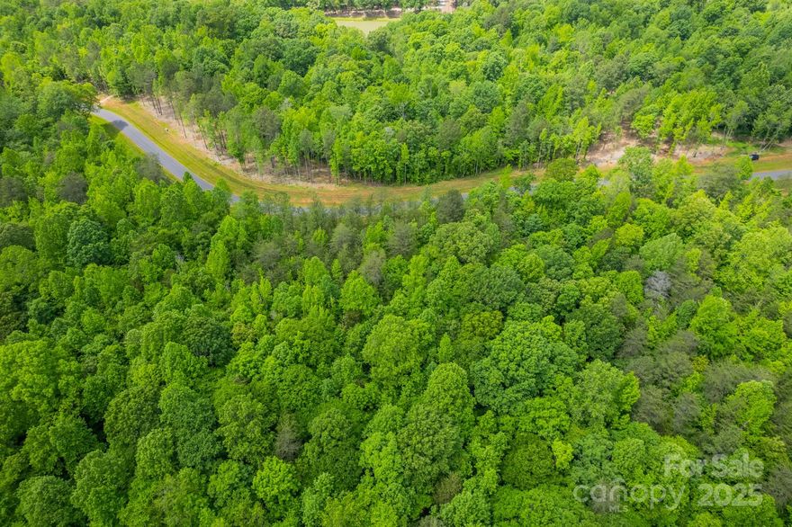 Ventosa at Mattie Rose is a tranquil community primarily built out by Grandfather Homes. Approaching the entry gate, the meandering roadway sets the tone for the serenity that awaits. Spacious homesites range from 3 to 7 acres each nestled within a lush wooded setting. This idyllic retreat provides expansive outdoor spaces, perfect for those who appreciate nature’s beauty and seek a peaceful escape from the bustle of daily life. Community walking trails weave through the scenic landscape inviting residents to immerse themselves in the beauty of their surroundings. The community pond is perfect for leisurely fishing or enjoying the tranquil waters. These features combined with thoughtfully designed custom architecture create a blend of nature and luxury. At Ventosa at Mattie Rose, every moment is an opportunity to embrace a lifestyle of peace, beauty, and modern convenience. It’s a sanctuary where you can rejuvenate your spirit and inspire your daily life.