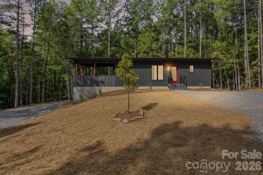 A Bespoke Modern Sanctuary: New Construction Luxury in Golden Creek, Union Mills, NC

Welcome to your ultimate mountain retreat! Nestled on a private 1.67-acre lot in the exclusive Golden Creek Subdivision—a neighborhood dedicated entirely to contemporary design—this brand-new, 3-bedroom, 2.5-bath home offers an unparalleled blend of modern luxury and natural serenity.

Unmatched Design & Wellness Amenities:
Experience seamless indoor/outdoor living with expansive floor-to-ceiling windows and soaring vaulted ceilings that frame the lush, private forest views. The central living area features a stylish stone fireplace and smart recessed lighting with nightlight accents, creating instant ambiance. This is a turn-key escape designed for total rejuvenation.

Exceptional Features Included:
The home is an oasis of wellness, featuring an exterior Sauna and Hot Tub for year-round enjoyment, complemented by a convenient Outdoor Shower and a dedicated Pet Spa!

The Ultimate Outdoor Entertainer:
Enjoy the seamless flow from the sleek, modern kitchen to the incredible outdoor spaces. The home boasts over 1,000sf of phenomenal combination of covered and uncovered deck areas, finished with durable Trex Decking and framed by contemporary cable railing. The covered space includes a fully equipped Outdoor Kitchen with a BBQ and Beverage Bar—ideal for entertaining while overlooking your private, wooded acreage.

Built for Durability & Convenience:
This home is completely turn-key and low-maintenance, featuring a robust metal roof and includes ALL appliances shown (Washer/Dryer, BBQ, Beverage Bar, Sauna, and Hot Tub). Perfect as a luxurious primary residence, a fantastic family getaway, or an immediate, high-end short-term rental investment.

Schedule your private showing today and step into your brand-new modern sanctuary!