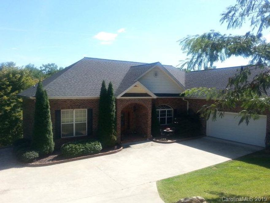 Enjoy One Level Living, in this Beautiful 3BR/2.5BA Custom Built Waterfront Home.   Home Features Open Floor Plan, Hardwood Floors, Kitchen with Granite Countertops and Stainless Steel Appliances. Over 2000 square feet in basement area, that could very easily be finished for additional living area. Home is located in a Deep, Quiet Cove with Lake Views. Gentle Sloping on Lake Side of Home , Curved Stairs with Lighting, that lead to Large Dock with Boat Lift. Home is surrounded by 1.21 acres, with over 180' of lake frontage .