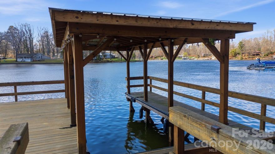 Welcome to your own slice of lakeside paradise! This lakefront home sits on a 2.5+ acre lot, offering the ideal blend of privacy, comfort, and scenic water views. Enjoy direct lake access with your HUGE newer private dock with covered boat slip! Inside, the open-concept floor plan creates an inviting flow between the main living spaces, highlighted by a cozy fireplace in both the living room and the lower-level great room. Step outside to experience true indoor-outdoor living with a lakeside deck, screened-in porch, and a lower-level covered patio. Primary BR on main! Tax value $643,550 reflects the new 2026 Davidson County valuation. Tax rate and total tax amount listed are based on 2025 figures. 2026 tax rate projected TBD mid-2026.  Pier permit with Cube Hydro: $100 annual renewal fee. One-time $175 pier transfer fee to be paid by buyer at closing. Preapproved buyers welcome!