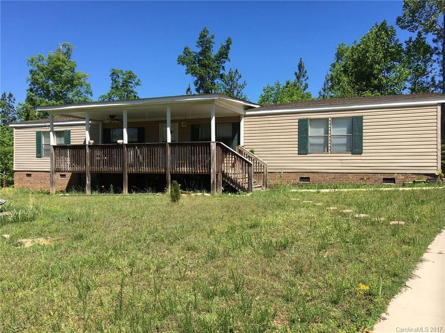 Well-maintained 3 bed/2 bath home on 5+ acres of land. New dishwasher and roof. Great Room with fireplace. Enjoy the quiet countryside on your front porch. Sold "as is." Seller will not make repairs. Priced to sell!