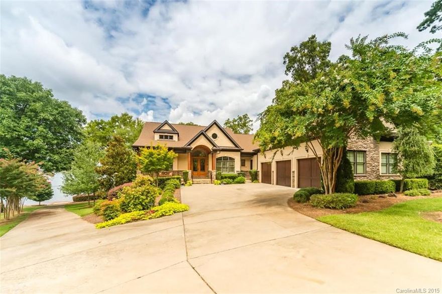 Extraordinary year round main channel views from this impressive custom built waterfront home in ideal location! Gourmet kitchen, vaulted ceilings, granite throughout. Custom water purification system, security system, and intercom.  Perfect for entertaining with basement bar/billiard, sound system, zoned heat & A/C, generator, and steam room! 4 covered porches, fire pit, onsite grandfathered boat ramp, covered dock with lift and 2 jet ski lifts. Landscape lighting and irrigation system.