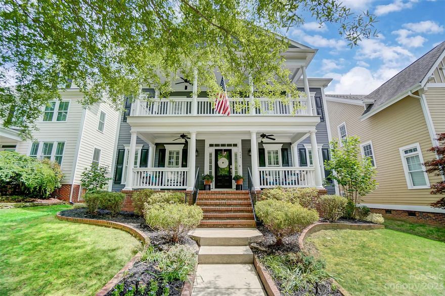 Fantastic Saussy Burbank "Hampton" plan with gorgeous double porches on highly desired Revival Row in Baxter Village! Step onto the huge front porch and into the main level featuring a dedicated office with great built-ins, a warm dining room, and a huge family room with stone fireplace opening into a dream kitchen space, just perfect for gathering! Hop upstairs to the primary suite, 1 en-suite bedroom with walk in closet, 2 additional bedrooms with walk-in closets and an oversized bedroom/bonus with endless possibilities! This beauty also features 36 solar panels, a tankless hot water heater and multiple smart home features! Relax on the top porch for a birds eye view of this beautiful tree lined street, or hop over and enjoy Baxter's impressive amenities to include a town center with shops, eateries, fitness, library, 2 community centers, 2 pools, tennis, trails, playgrounds, parks and so much more! Welcome home to the incredible "live, work, play community" that is Baxter Village!