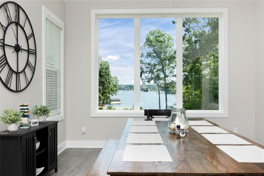 Enjoy the beautiful views from this well maintained home. Property currently being used as VRBO. Owner already has bookings in place totaling $64,000 in revenue for 2023. Quiet cove opens to big water. Enjoy relaxing at the gazebo area on dock with covered private boat slip.  Light open kitchen features soft close cabinets,  stainless steel appliances and luxury kitchen island. There is plenty of room to entertain in this home which has an open floorplan. Stylish LVP flooring throughout main and upper floor. Owner suite on main with gorgeous lake views. Primary bath with dual vanity, tiled shower free standing tub & spacious walk in closet. Enjoy beautiful lake views from practically every room in the home. The upper floor has a spacious media room. Two additional bedrooms a loft/ game room, and three full bathrooms. Step out back to enjoy year round entertaining on your screened in porch. The deck is the perfect space for grilling. This property is TURN KEY.  All this with no HOA!!!!!