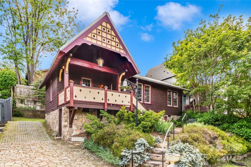 Enchanting Montford vintage jewel box, on a no-through street, within walking distance to 5 points shopping and downtown. Perfect for a weekend pied-à-terre, STR or cozy primary home - it features numerous architectural details, vintage cabinetry and antique stained glass touches.  From the schoolhouse slate flooring and original hardwoods, old world lighting and whimsical woodwork - this gem is a must see! Wainscoted living and dining rooms flow effortlessly into a spacious light filled kitchen with soapstone counters, and farmhouse sink. indoor-outdoor living on the sun drenched screened porch and magical private garden and patio complete this sanctuary! Come enjoy bird song and pealing church bells in this storybook cottage.