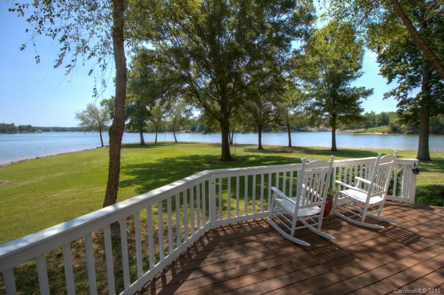 Sweet waterfront property!  Approx. 400' shoreline, ranch style home on 2/3 acre super level lot.  Panoramic views overlooking the Little Allison channel of Lake Wylie. Home has been beautifully maintained and is ready to move in. You'll love the hardwood floors throughout, spacious kitchen, elevated ceilings.  And, oh, the views!  Dock with boat lift and covered seating area, plus swim platform.  One of the most economical areas of the lake, with low county taxes, no HOA. Great Clover schools.
