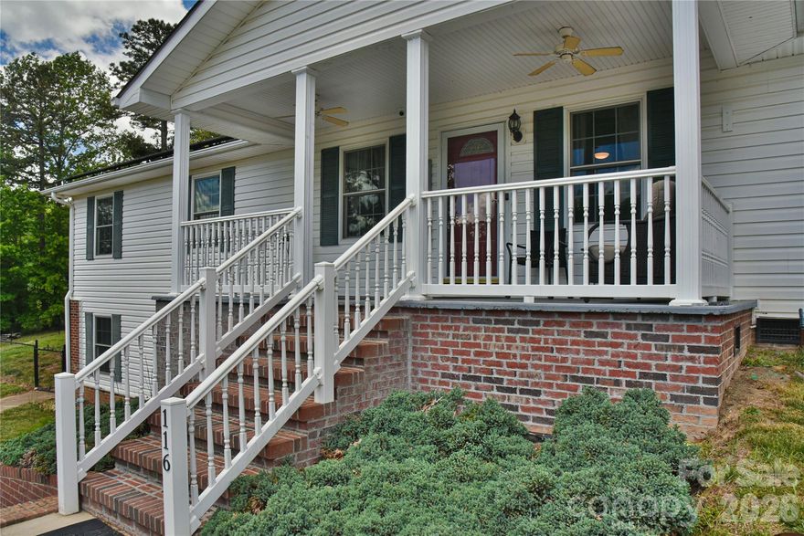 Tucked away on over an acre in Flat Rock, this custom-built home offers mountain views, peaceful surroundings, and easy access to Hendersonville, I-26, shopping, and dining. Designed for comfortable one-level living, the home features a bright, functional layout with spacious living areas and quality finishes throughout.

The main level includes hardwood floors, an inviting living room, a dedicated dining space, and a well-appointed kitchen with pantry storage and nearby laundry. The primary suite provides a relaxing retreat, while two additional bedrooms offer flexibility for guests or hobbies. Built-in shelving and storage solutions throughout the home add both character and practicality.

The partially finished lower level expands the living space with a versatile bonus area, exterior entry, and ample room for storage, projects, or recreational use. An attached two-car garage adds even more convenience. Solar panels installed in 2020 help improve energy efficiency.

Enjoy the outdoors from the covered front porch, back deck, or fire pit area overlooking the level yard and surrounding mountain scenery. Combining privacy, usable land, and a convenient location, this property offers the best of Western North Carolina living.