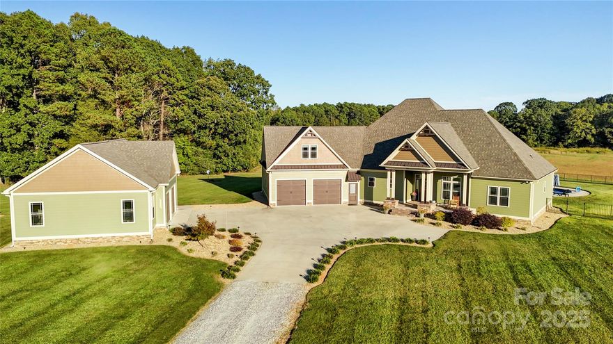 Welcome to 440 Mount Vernon Park Rd, a luxury private estate situated on 43 stunning acres offering the perfect blend of elegance, functionality, and peaceful seclusion. You’ll never run short on privacy or possibilities here. The immaculately maintained main home features an open floor plan with high ceilings, split bedrooms, and a large upstairs bonus room suitable for a variety of uses. Beautiful finishes and thoughtful updates throughout make this home truly move-in ready. All you need to is unpack and start enjoying your estate. Step outside to your own backyard bliss with a saltwater pool, hot tub, outdoor shower, and pool house/second living quarters — all within a fully fenced area, ideal for entertaining guests or keeping the family gathered together. The property includes multiple powered detached garages and a large 1,800 SF workshop/RV garage with 240V service, perfect for projects, hobbies, or storing all your toys. The home is also wired for a whole-house generator, providing added peace of mind. The land itself is breathtaking — rolling fields, woods bordering a creek with a natural spring, and an area perfectly suited for a future pond. Wildlife abounds, creating a true country sanctuary just waiting for its next family to call it home. 440 Mount Vernon Park Rd truly offers it all — a rare opportunity to own a property that needs absolutely nothing except you.