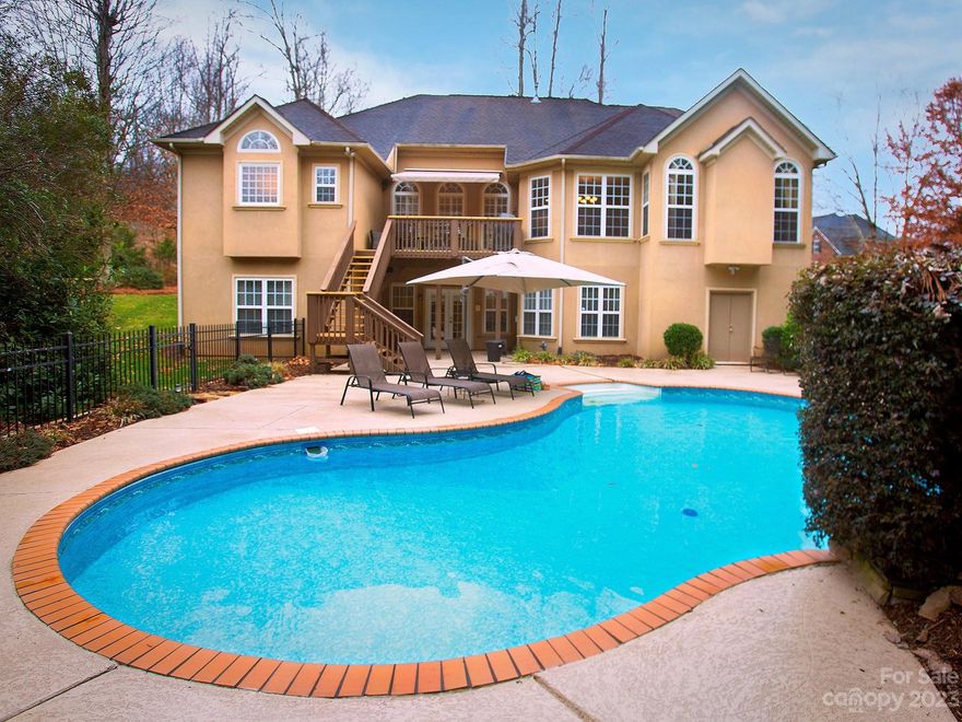 Indulge in opulent living at this exquisite 6-bed, 3.5-bath luxury haven. Awe-inspiring hardwoods grace the main floor, leading to a renovated owner's suite, a sanctuary of tranquility with a separate sitting area in your bedroom and a meticulously crafted bathroom that boasts a stunning tile shower with frameless glass, embodying modern elegance with custom closet organization too. The allure continues outdoors to a private backyard oasis, complete with a refreshing swimming pool. Descend to the expansive basement, a haven for entertainment with a movie theater room, gaming room, personal gym, 2 additional bedrooms, and a full bath. Need a home office (or 3)? Choose any floor you want. So much room to spread out! You'll also enjoy conveniences like a tankless water heater, tons of storage everywhere, and a location that's a stone's throw to shopping/dining in downtown Mint Hill. This home offers unparalleled and limitless possibilities for a discerning lifestyle.