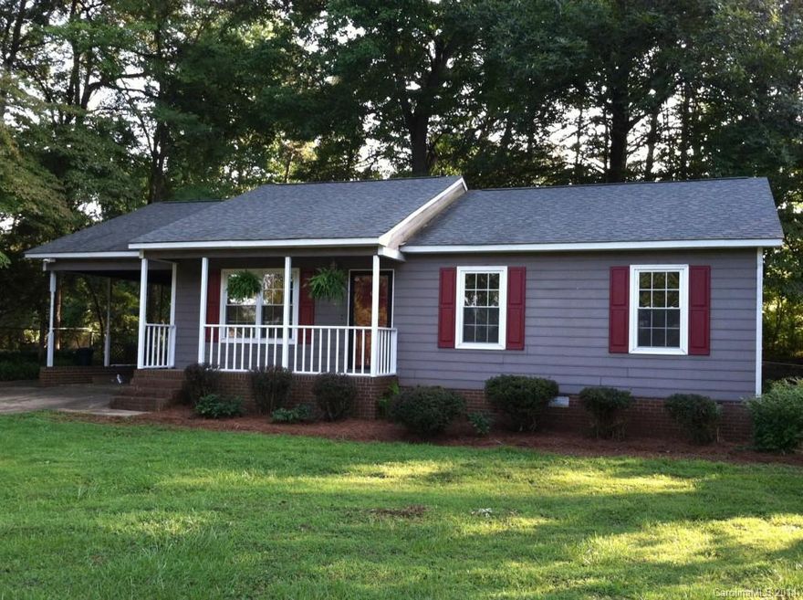 Cute home in  a very desirable Mt.Holly community. This home has been completely renovated!! The lot is a spacious "corner lot" with large mature trees to give great shade in the back yard and a nice front yard that's very open with an unobstructed view. Inside the home, all flooring has been replaced with either carpet, 12" ceramic tile or 12.3mm laminate flooring (extra thick). Fresh paint throughout and new fixtures as well. The kitchen... Stainless stove/oven, dishwshr, and island range hood