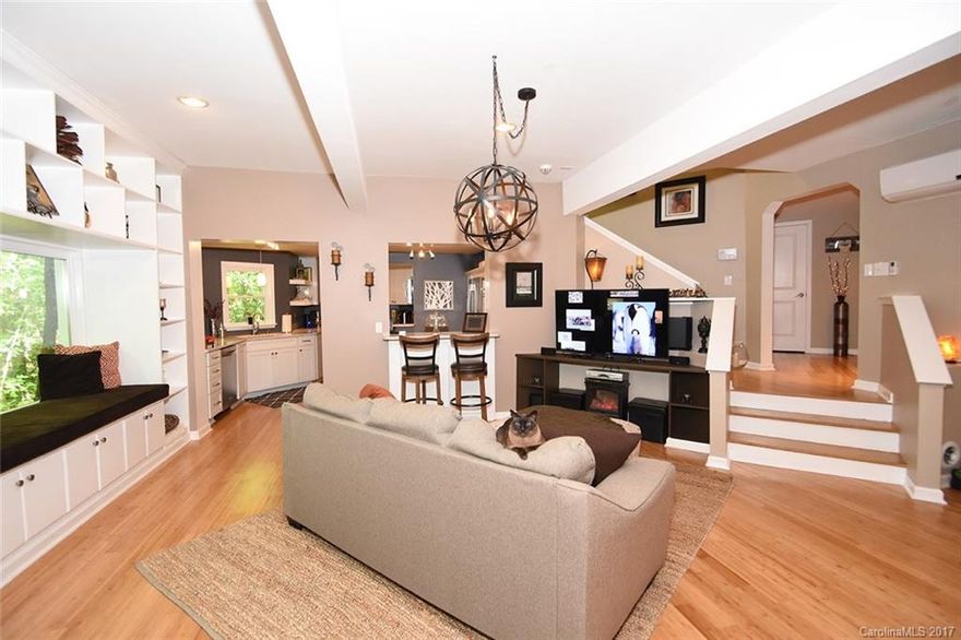 A Lake Wylie retreat awaits in this architectural house where home and nature become one. Built in 2013, this home boasts of beautiful design and environmental responsibility.  The home features bamboo floors, a wood burning stove, and an energy-efficient mini split system, to name a few.  An expansive wrap-around deck provides seasonal lake views and hours of relaxation. In town amenities and a public boat launch are close-at-hand, and yet, this rare gem sits on over 2 acres of land.