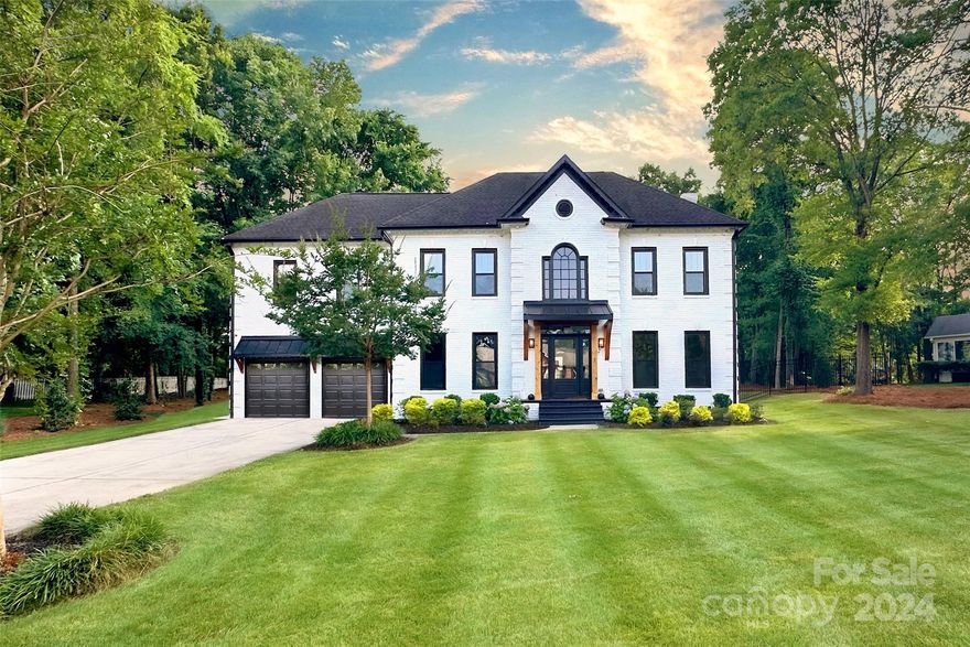 Prepare to be blown away by this home's luxurious and modern design. From the newly stained hardwood floors to the savvy, open, designer kitchen to the cabled-custom stairs, this home lives like no other and even offers remote operated privacy drapes. The gorgeous brick facade with lush landscaping opens to a magazine-like entry and there is so much flexible living space. The stately grand piano room could also be an open dining room or a study. The kitchen, with its new cabinetry and tops and light fixtures is a dream w/ a designer wet-bar opening to a pantry with built-ins, laundry, and separate flex space. Upstairs offers spacious bedrooms/baths and a primary bedroom and spa-like bath experience that is rare. Outside, enjoy a private almost half-acre view, a fire pit, and a almost new saltwater hot tub with optional electric awning with built-in lights for entertaining. All of this and minutes from 4-85 close to Concord Mills/ Concord and 17 minutes to Uptown Charlotte. Must see!