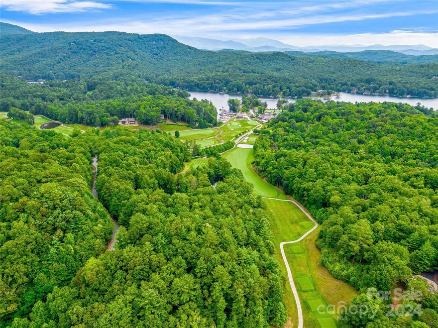 1.43 acres with 273’ of frontage on #18 makes for very close proximity to the Lake Toxaway Country Club and Lake Toxaway Marina. Gently sloping terrain makes for an easy build for the home of your design. The native hardwood canopy, rhododendron, and mountain flora and fauna assist in the natural landscape design. Plans for a 2,686 sq ft, 3 bed, 3.5 attractive golf cottage on file, along with 4 bedroom active septic permit, site plan, preliminary survey and topo map. LTCC membership is based on availability and approval.