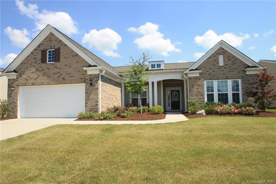 Coveted Dunwoody Way Model with Sunroom. Kitchen Features Granite Countertops, Large Island & Serving Bar, Tile Backsplash, Under Cabinet Lighting, Walk-In Pantry, SS Appliances Including Cooktop Stove & Wall Oven, & Dining Nook. Great Room w/ Gas Log Fireplace & Built- Ins. Screened Porch Opens to Patio w/ Lake Views. Owner's Suite w/  Tile Shower, Dual Sinks, Built In Vanity, & Walk In Closet. Hardwoods Throughout. This Incredible Floor Plan is a Rare Find in SCCL- 55+ Active Adult Community.