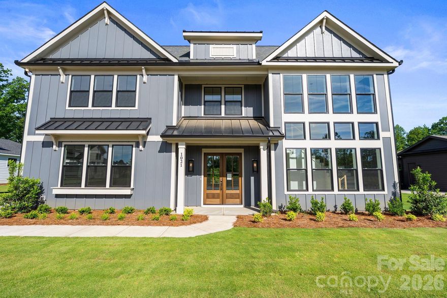 Welcome home to effortless luxury in The Bluffs at Wesley Chapel—where thoughtful design meets an unbeatable setting.

This brand-new, move-in-ready home offers 4,554 sq. ft. of beautifully curated living space on a .46-acre, tree-lined lot overlooking 12 Mile Creek. The primary suite on the main level delivers a private retreat, complemented by an additional guest bedroom or study with ensuite on the main floor—perfect for visitors or work-from-home flexibility.

At the heart of the home, the Luxe kitchen upgrade shines with Wolf and Cove appliances, custom details, scullery, and seamless flow into the living area, where a primo fireplace anchors the space with warmth and style. Entertaining is effortless with a dry bar featuring an antiqued mirror, as well as a wine display adding character and sophistication.

Designed for everyday convenience, the home includes laundry rooms on both the main and upper levels, while upstairs living spaces provide room to spread out. Step outside to the covered rear porch with fireplace and take in peaceful creek views—your own private backdrop for morning coffee or evening gatherings.

All of this is set just 2 miles from Wesley Chapel Town Center, offering quick access to shopping, dining, and daily conveniences.

Completed and ready to close, this exceptional home delivers luxury, location, and livability—without the wait. Reach our to schedule your private tour today and ask about our current builder incentives!