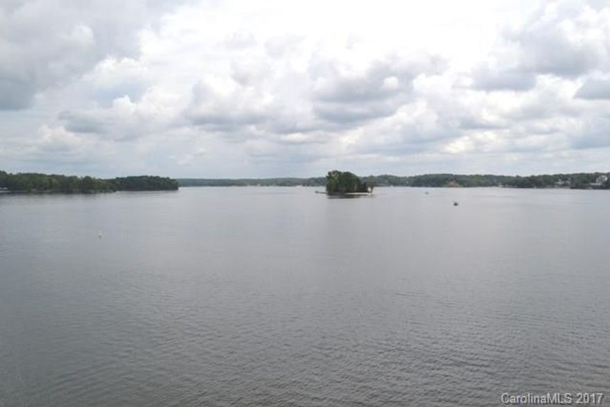 AMAZING MAIN CHANNEL VIEWS from living room, master, and dining. One mile view! 
2 BR, 1 office, 1 bonus, 4 baths. Entire condo beautifully remodeled with stainless, granite, hardwoods, cabinets and fireplace.