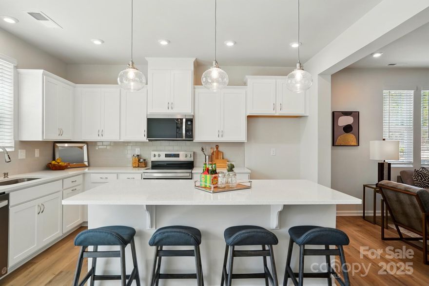 Welcome to The Amira, a beautifully designed townhome offering modern comfort and stylish living.  The first floor features a welcoming front porch and foyer, leading to an open and inviting gathering room.  The spacious kitchen boasts a walk-in pantry, ample counter space, and flows seamlessly into the breakfast dining area.  A powder room and access to the one-car garage add convenience, while the patio provides a perfect out door retreat.  

Upstairs, a large loft offers flexible living space.  The owner's suite is a true sanctuary with a walk-in closet and an en-suite bath featuring a walk-in shower with seat and dual vanity.  Two additional bedrooms, a full-size bathroom, linen closet, and laundry room complete the second floor. 

With its thoughtful layout and modern finishes, The Amira is designed for effortless living.