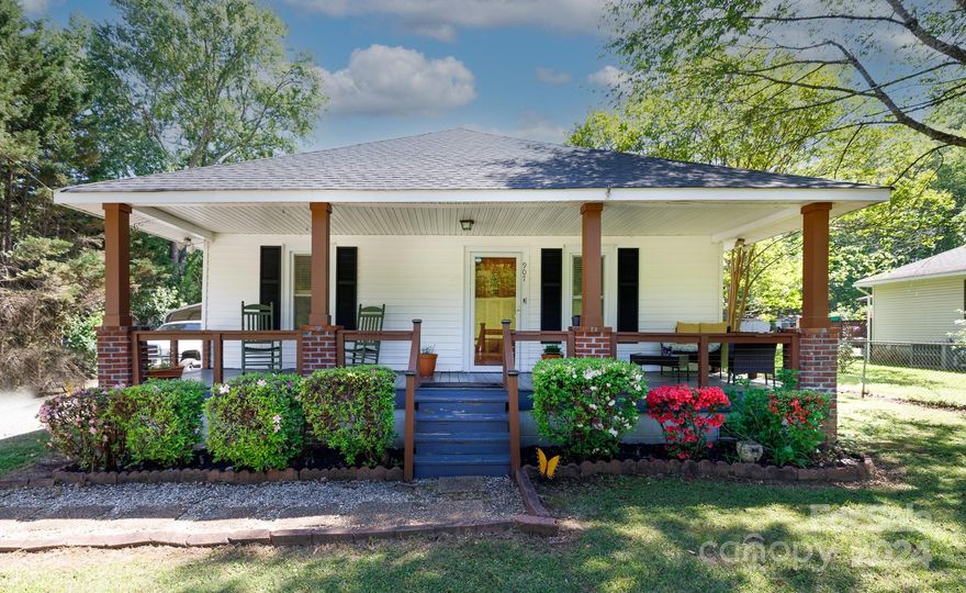 THE PORCH! LARGE LOT! UPDATES! You will love the oversized front porch and cozy floorplan which includes primary bedroom suite w/ walk in closet and soaker tub!  The eat in kitchen is large and overlooks the yard.  The back deck is perfect for entertaining and grilling.  Updates include 2018 roof, 2016 furnace, 2016 HVAC, connection to city sewer and more!  2 storage buildings, fenced in back yard and a double entry driveway makes this a rare find...all situated minutes from town, shopping, interstates and schools!  Make this one home today!