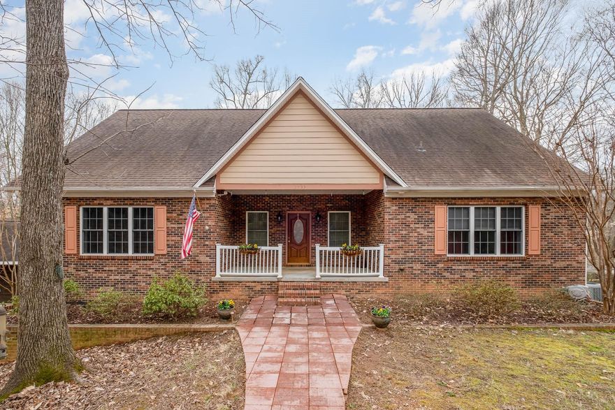 Can you just imagine yourself sipping coffee in the morning sun on this Rockingchair front porch? Or maybe you’ll enjoy an evening out on the deck grilling with friends while your dog plays in the fenced-in backyard? Either way, you are sure to love this country like setting just minutes from the conveniences of city life.
Located just 7 miles from the Charlotte Douglas airport, and only 0 miles from the name of outlet mall, this 1.7 acres of nature are sure to be the oasis you are looking for. 
Inside, you will find a spacious great room with vaulted ceilings, chefs kitchen complete with breakfast bar and eat-in area, three bedrooms and two full bathrooms. The nearly 1300 square-foot basement allows for endless possibilities with an additional bedroom, full bathroom, 2 common areas, storage galore and private access to the back yard.  With all of this, as well as an additional detached garage/workshop- you’ll never want to leave home!