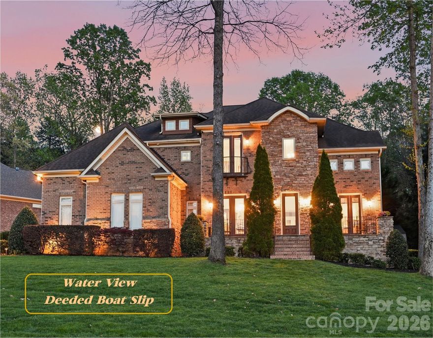 Elegant 4BR/3BA/2HBA home with 4,497 sq ft on a private 0.39-acre lot featuring Sunset Lake View and a Deeded Boat Slip with lift. This beautifully crafted home offers lovely Architectural Details, crown molding, hardwood floors, an open floorplan, Vaulted, Tray and Coffered Ceilings,
multiple built-ins, and spacious living areas throughout. Main level includes a Gourmet
Kitchen with Chef's GE Monogram gas 6 burner cooktop with griddle, double ovens, food warmer and pot filler. Also, built-in microwave, wine refrigerator, walk-in pantry, breakfast nook, and breakfast bar. First-floor
primary suite features a spa tub, heated towel rack, walk-in shower, dual vanities, and
oversized custom walk-in closet. Additional spaces include an office with French doors and a beautiful view of Lake Norman. The second level boasts a loft, billiard/entertainment room with a balcony overlooking the pool, media/theater room and a finished storage room with a Murphy bed. Outdoor living shines with a fully fenced, professionally landscaped backyard, Pebble Tech kidney-shaped pool with waterfall, travertine deck,
fire pit, covered porch, irrigation, and landscape lighting. This exceptional property also includes 3-car garage, storage shed, alarm system with cameras, whole house intercom/music system whole-house dehumidifier, wired TV/internet, and transferable 2-10 home warranty.