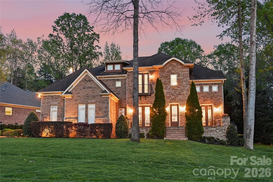 Elegant 4BR/3BA/2HBA home with 4,497 sq ft on a private 0.39-acre lot featuring lake
views and a deeded boat slip with lift. This beautifully crafted home offers exquisite
woodwork, crown molding, hardwood floors, an open floorplan, vaulted/tray ceilings,
multiple built-ins, and spacious living areas throughout. Main level includes a gourmet
kitchen with Chef's GE Monogram gas 6 burner cooktop with griddle, double ovens, food warmer and pot filler. Also, built-in microwave, wine refrigerator, walk-in pantry, breakfast nook, and breakfast bar. First-floor
primary suite features a spa tub, heated towel rack, walk-in shower, dual vanities, and
oversized custom walk-in closet. Additional spaces include an office with French doors and a beautiful view of Lake Norman. The second level boasts a loft, billiard/entertainment room with a balcony overlooking the pool, media/theater room and a finished storage room with a Murphy bed. Outdoor living shines with a fully fenced, professionally landscaped backyard, Pebble Tech kidney-shaped pool with waterfall, travertine deck,
fire pit, covered porch, irrigation, and landscape lighting. This exceptional property also includes 3-car garage, storage shed, alarm system with cameras, whole house intercom/music system whole-house dehumidifier, wired TV/internet, and transferable 2-10 home warranty.