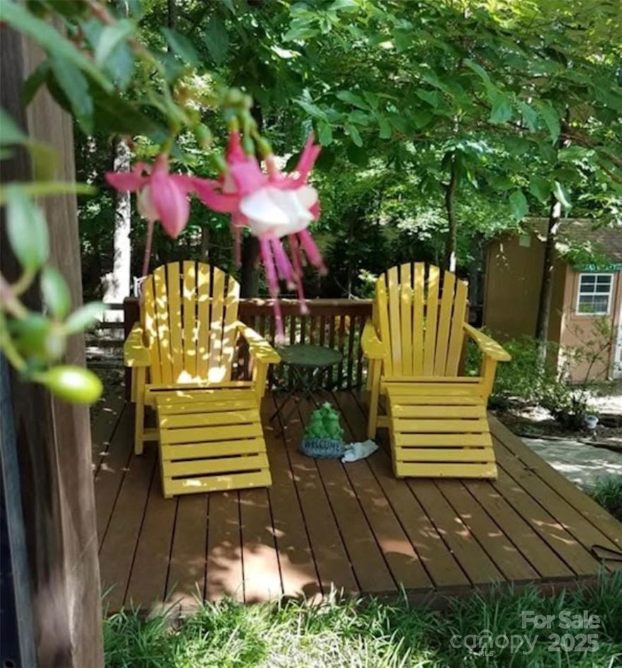 This lovely 3-bedroom, 2.5-bathroom home offers charm & a peaceful retreat, especially during the spring & summer months when the backyard transforms into a serene secret garden. Enjoy watching the deer, owls,birds, &rabbits. Inside, enjoy updates including newer windows, tile plank flooring in the living room, carpet in the primary bedroom & LVP upstairs. The living room boasts a vaulted ceiling & a stone floor-to-ceiling fireplace, creating an open atmosphere. The primary bedroom, located on the main floor, features an updated bathroom w/ granite countertops & new lighting. The expansive backyard is a highlight, w/ a large deck, pond, shed, & a horseshoe pit—perfect for relaxing. With privacy from the wooded area behind, it offers a tranquil escape. Optional membership to the Sardis Forest Swim Club provides access to swimming & fun activities. Centrally located, minutes from Arboretum shopping, several private schools, TPC Piper Glen Golfing, McAlpine Creek Park, & Matthews events!