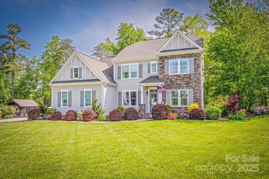 HUGE PRICE DECREASE on 10/4. Presenting a premier Lake Norman waterfront residence with 191’ of shoreline, offering exceptional lakefront living. Built by Copper Builders in 2017, this 3,458 sq ft custom home features a private dock with 2 boat lifts, 1 jet ski port, & a heated saltwater pool. Outdoor amenities include a Gazebo, patio, wood-burning fireplace, gas fire pit, &  an outdoor kitchen. The interior showcases a white gourmet kitchen with a gas cooktop, large island, and refined finishes. Enjoy lake views from multiple rooms. The main floor includes a spacious primary suite, office with French doors, & formal dining room. The 2nd level offers 3 bedrooms, 2 full baths, & a huge bonus room. Additional features include a large finished pull-down attic, a rear deck with covered section,  epoxy finished 3 car garage, & lake-fed irrigation. Includes a greenhouse, garden areas, & access to community pool, lake access, & boat storage. Convenient commute to Charlotte & airport. Listed below appraisal. HURRY on this great value!